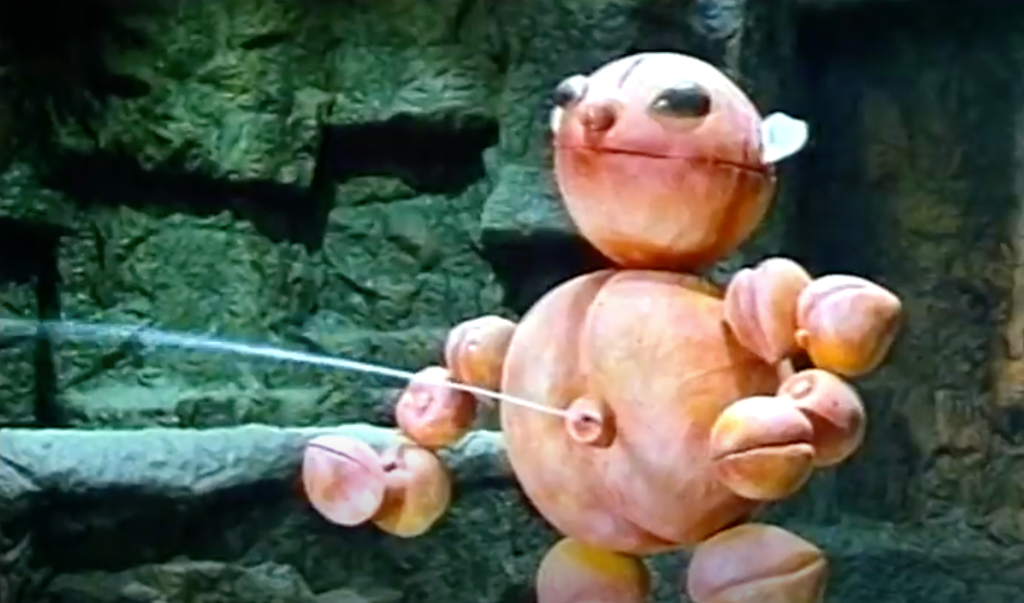The peach-creature squirts urine from its 'belly'...